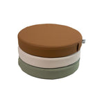 White sweep photo of a stack Foamnasium Roundabouts in Nutmeg, Auster, and Seagrass.