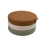 White sweep photo of a stack Foamnasium Roundabouts in Nutmeg, Auster, and Seagrass.