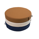 White sweep photo of a stack Foamnasium Roundabouts in Nutmeg, Auster, and Ink.