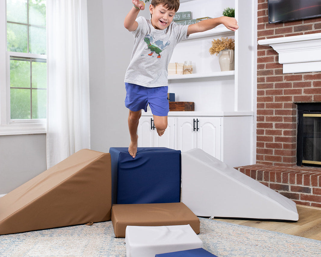 Boy jumping off Foamnasium Corner Climber