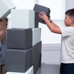 Children playing with foam blocks in a room.