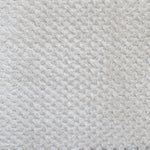 Close-up of a textured sand fabric surface