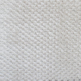 Close-up of a textured sand fabric surface
