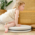 Lifestyle photo of young child crawling on Ink, Auster, and Nutmeg Roundabouts by Foamnasium.