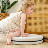 Lifestyle photo of young child crawling on Ink, Auster, and Nutmeg Roundabouts by Foamnasium.