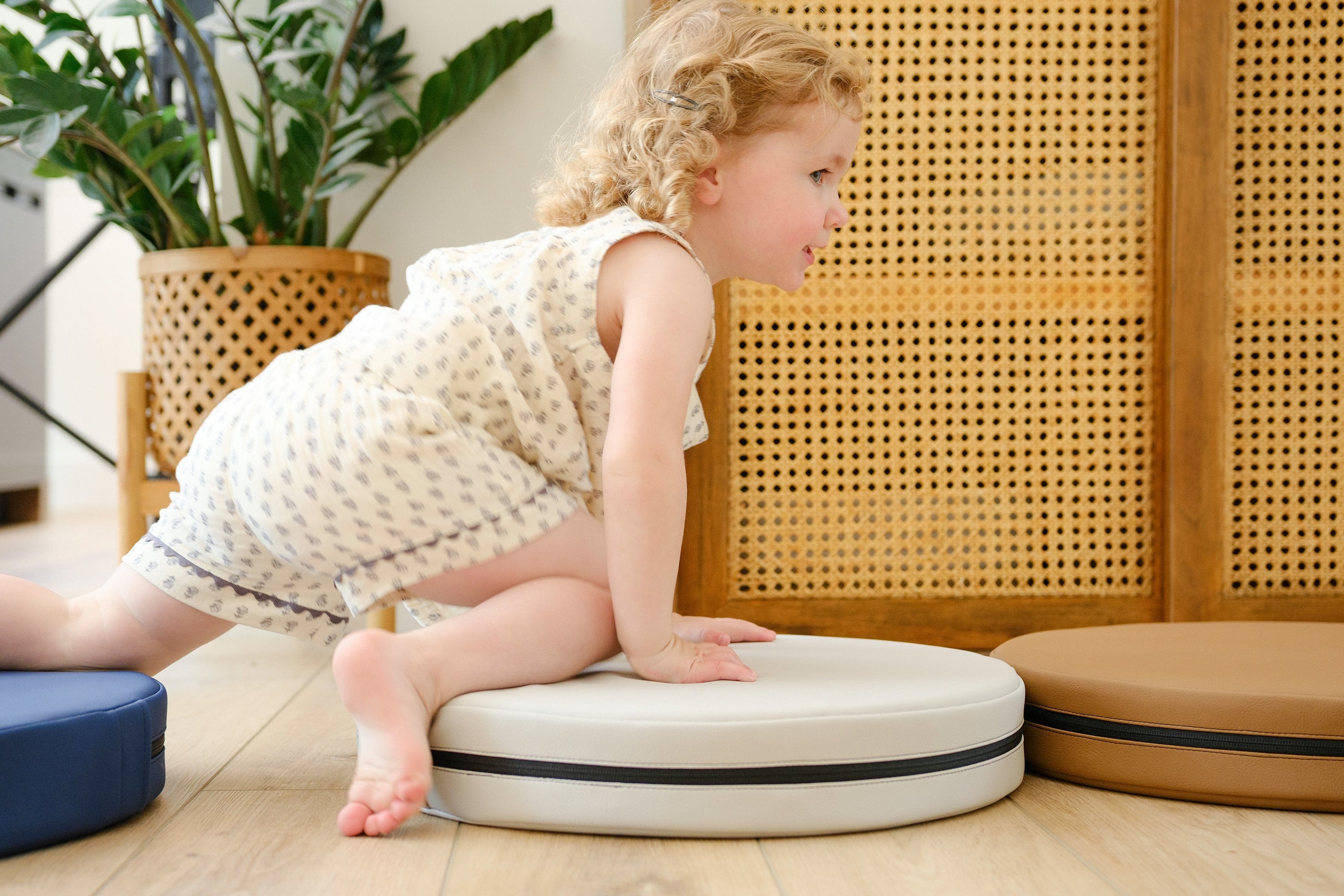 Lifestyle photo of young child crawling on Ink, Auster, and Nutmeg Roundabouts by Foamnasium.