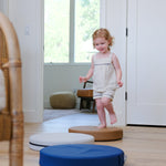 Lifestyle photo of girl playing with Ink, Auster, and Nutmeg Roundabouts by Foamnasium.