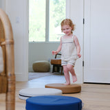 Lifestyle photo of girl playing with Ink, Auster, and Nutmeg Roundabouts by Foamnasium.