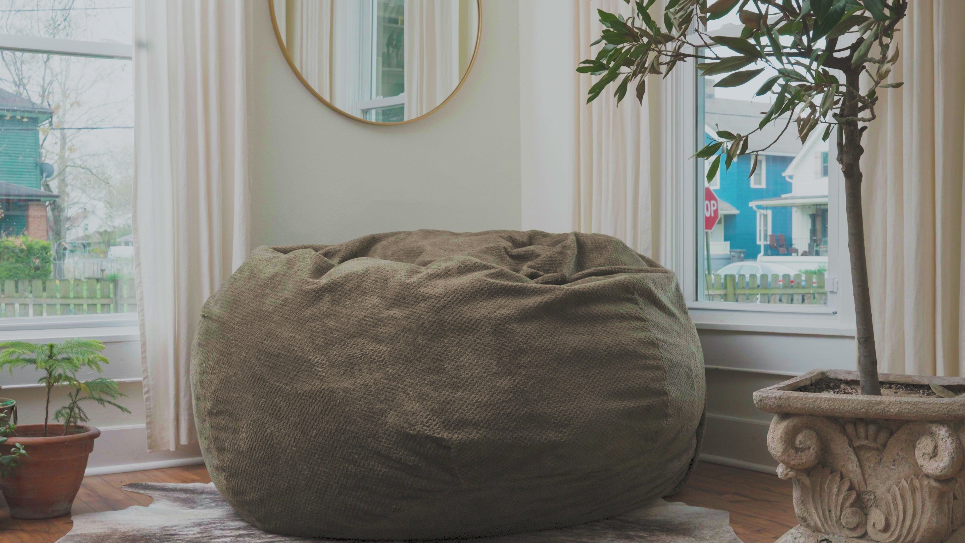 Video showing people sitting in a bean bag within a home