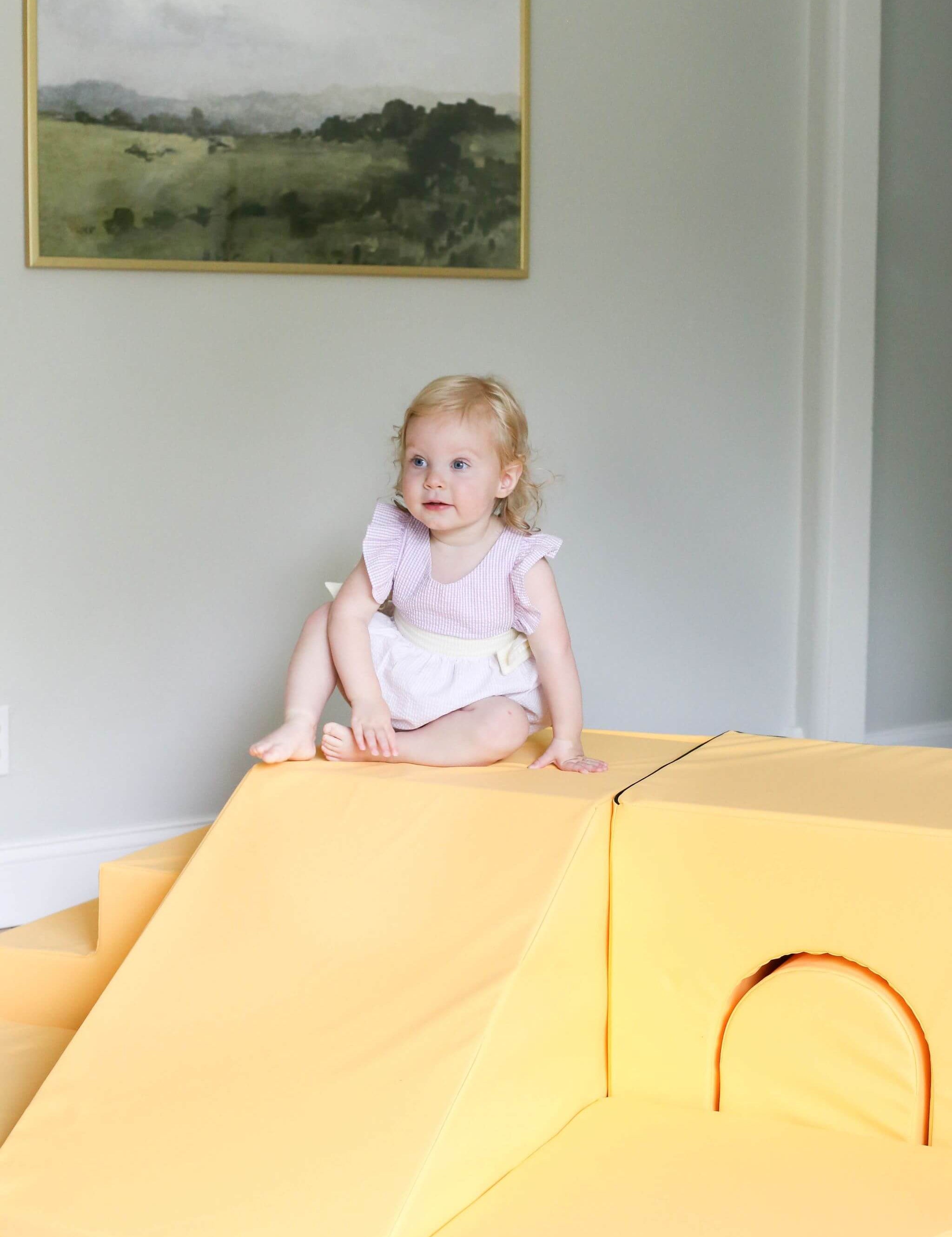 Lifestyle photo of a girl playing with an Enhanced Marigold Foamnasium Adventure