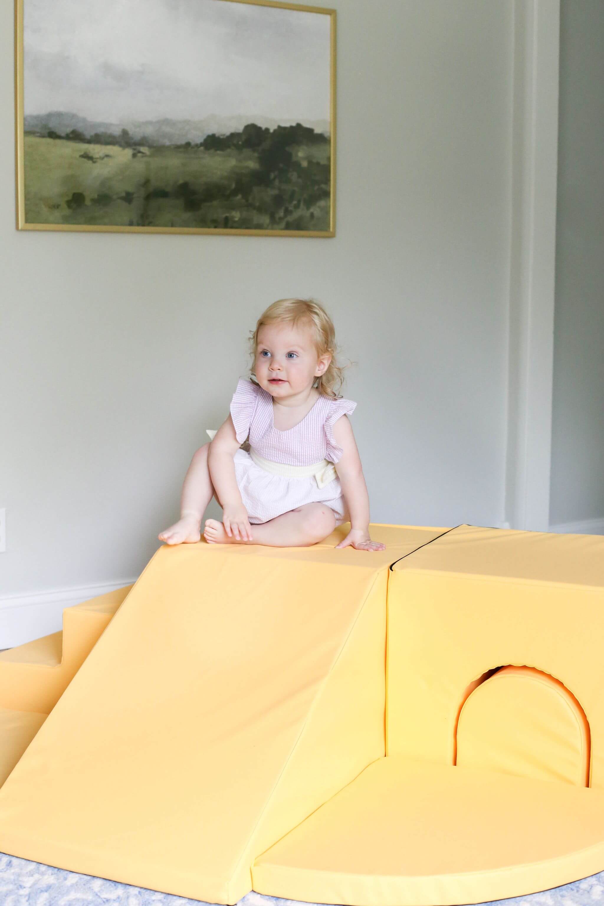 Lifestyle photo of a girl playing with an Enhanced Marigold Foamnasium Adventure