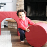 Lifestyle photo of a boy playing on Enhanced Crimson Foamnasium Arch