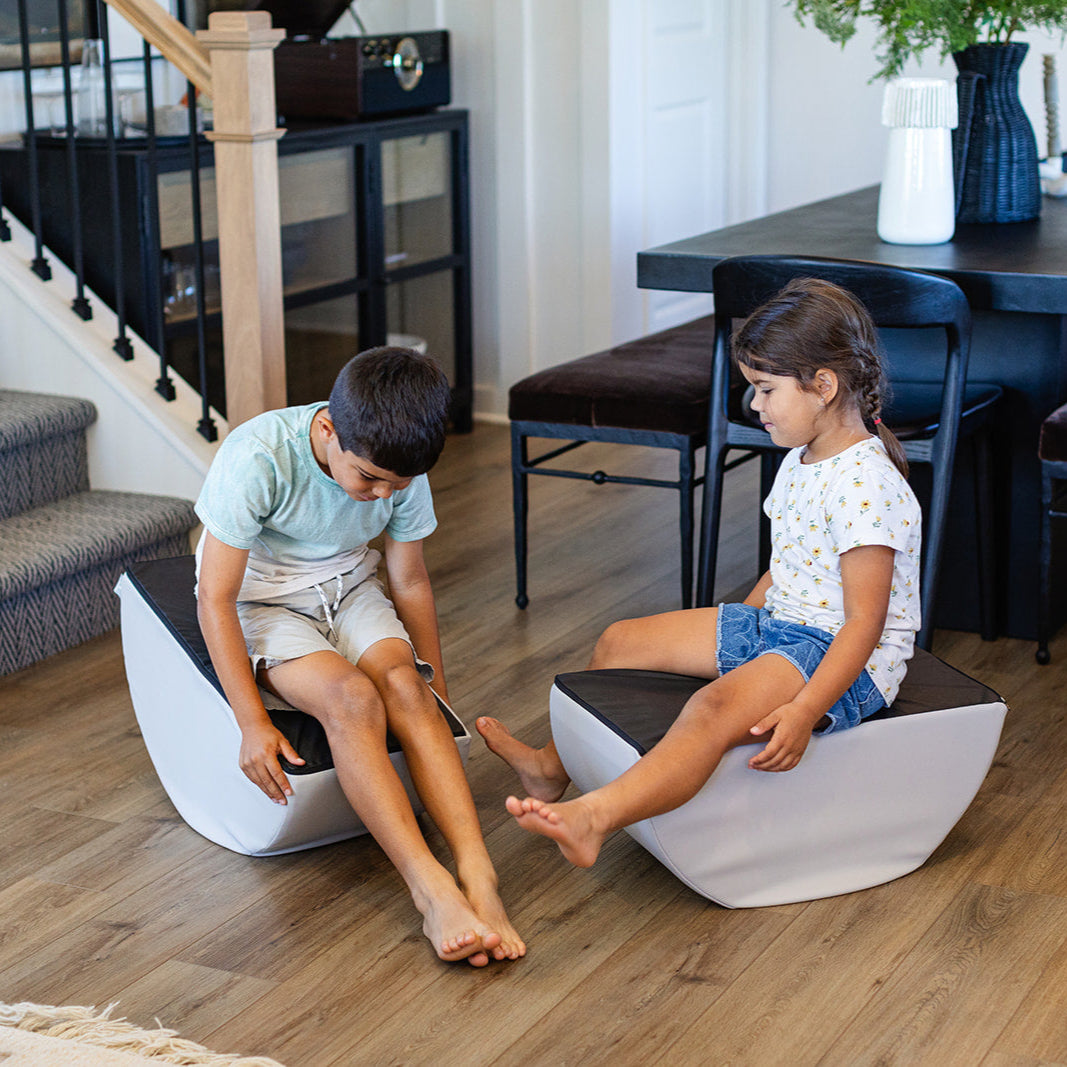 Two kids playing on Auster Foamnasium Mini Tumblers