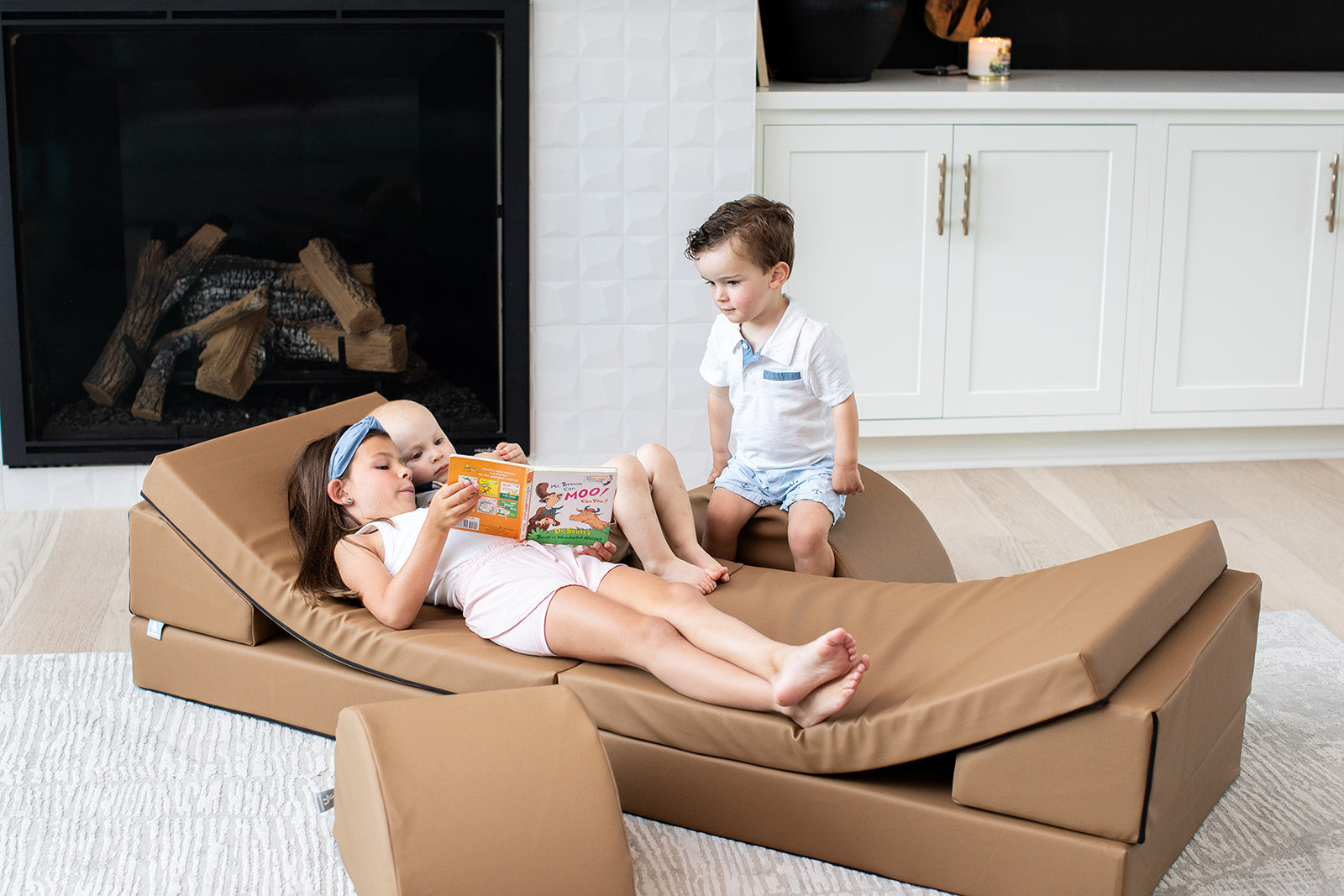 Lifestyle photo of two kids playing on a nutmeg blocksy+