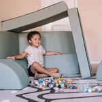 Boy playing in a Blocksy+ build in Seagrass color