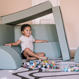 Boy playing in a Blocksy+ build in Seagrass color