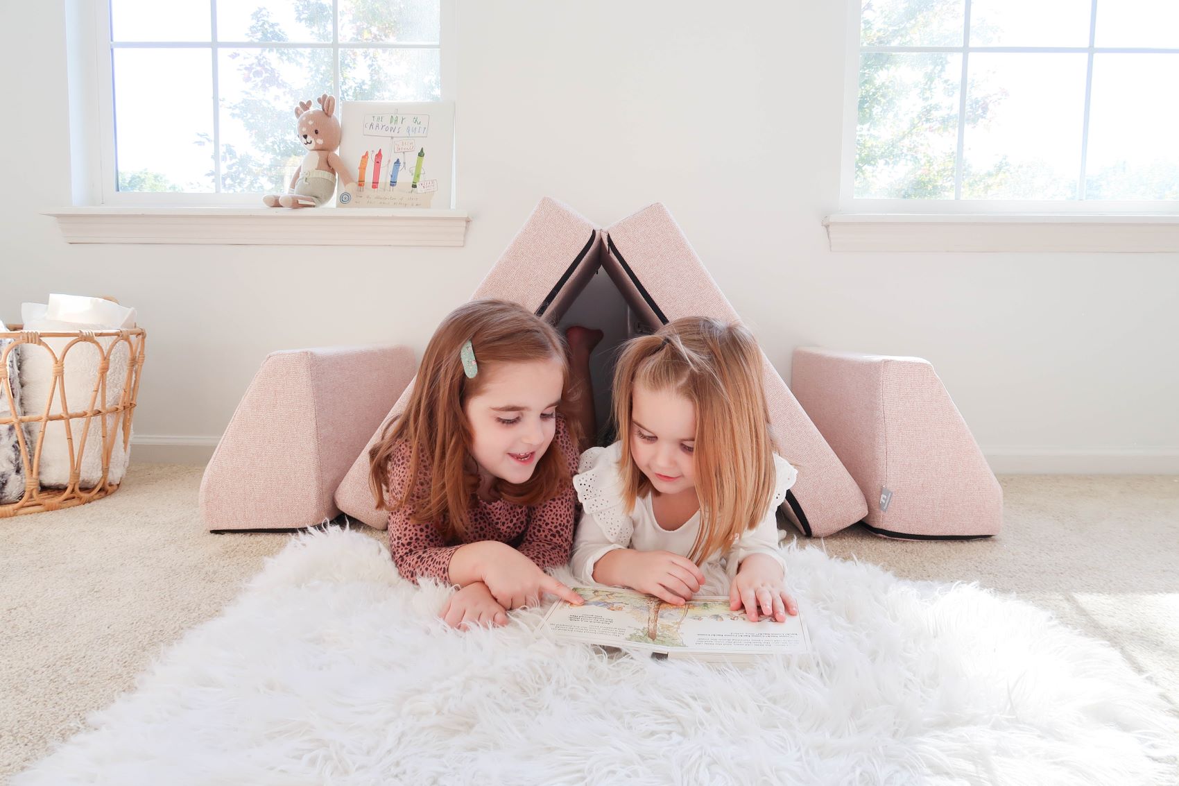 Lifestyle image of two girls playing on a blush blocksy mini