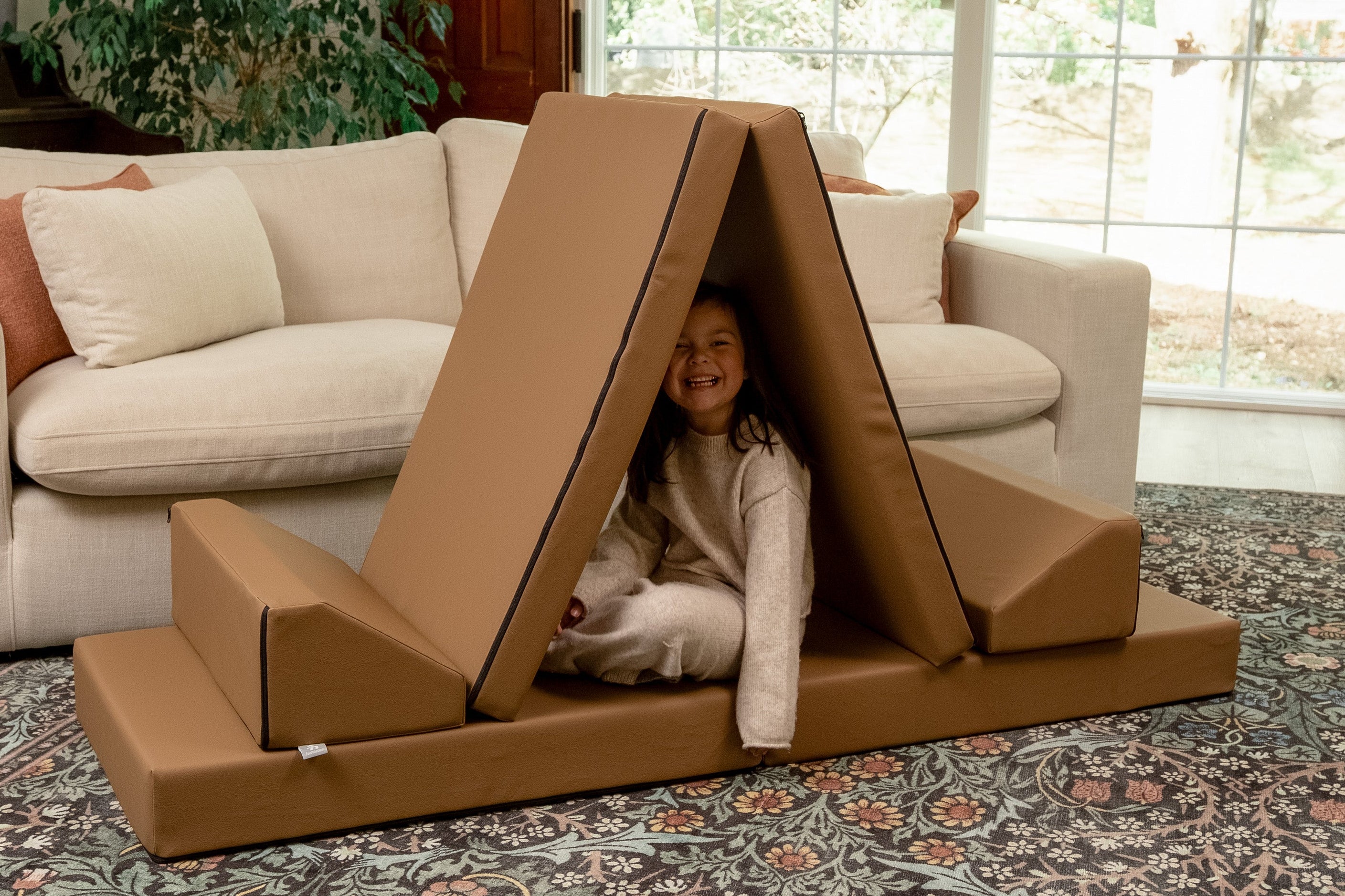 Girl peeking out of Foamnasium Blocksy teepee