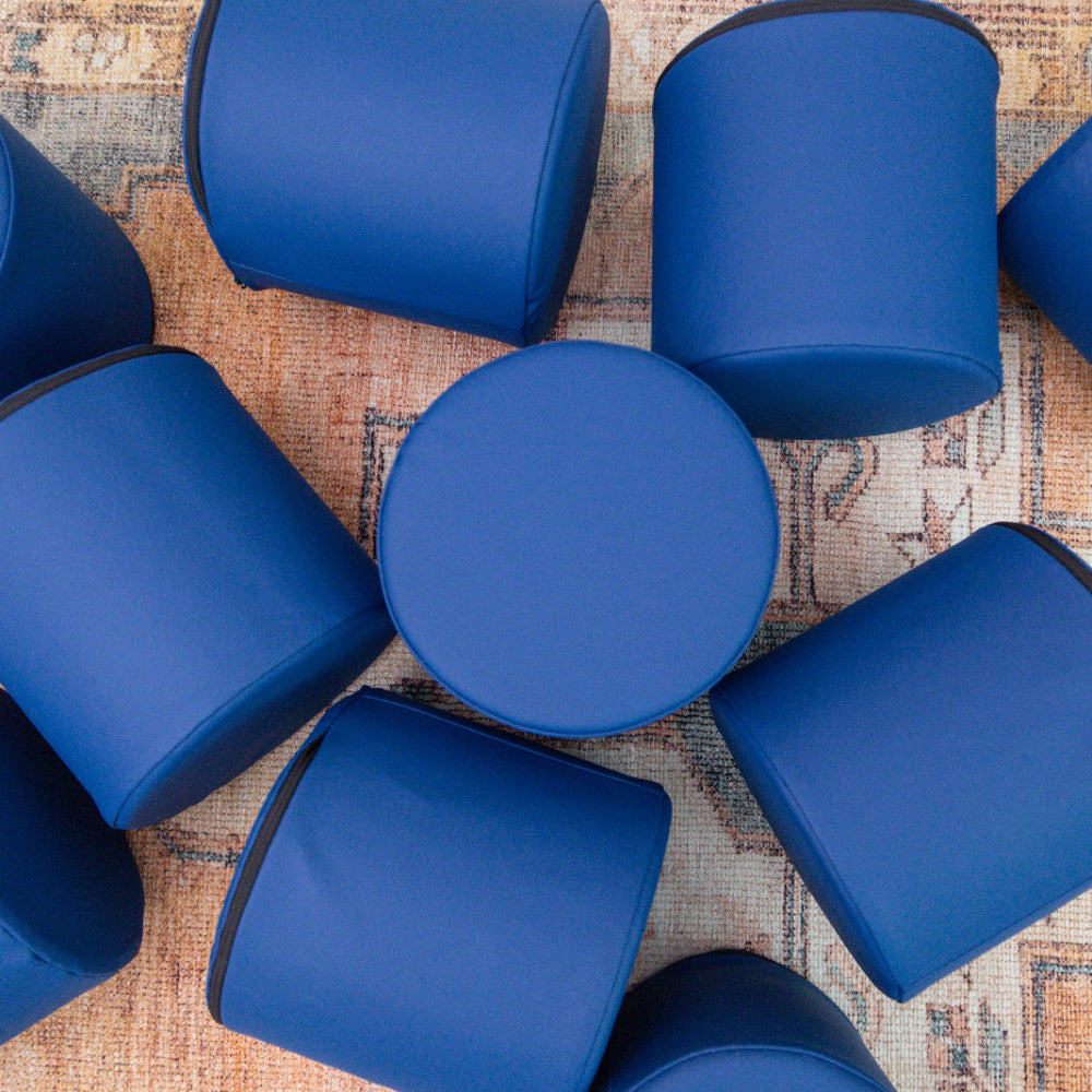 Pile of Navy Foamnasium Cylinders in living room 
