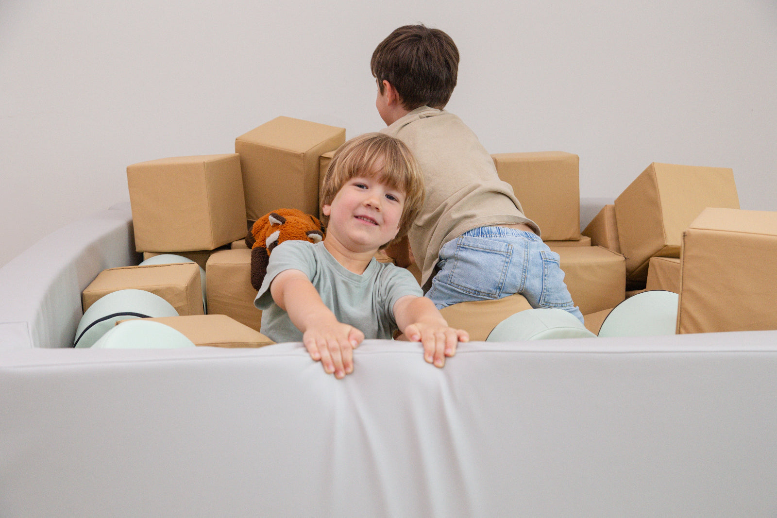 Two boys in Foamnasium Foam Pit with Cylinders and Cubes