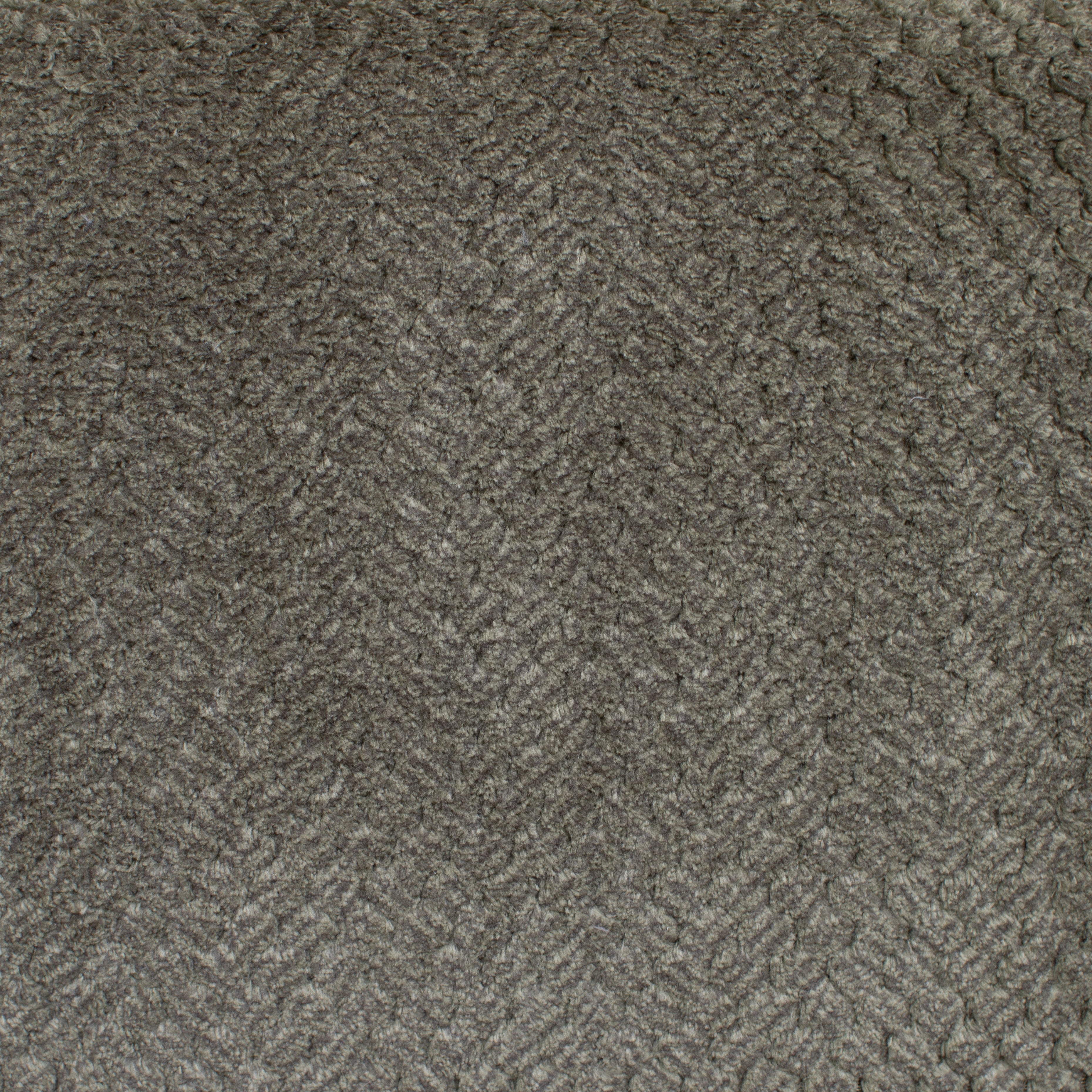 Close-up of a textured sage fabric with a herringbone pattern
