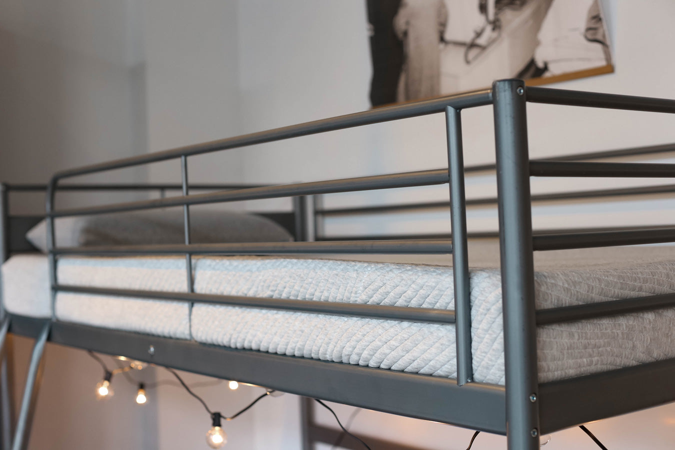 Lifestyle photo of an Alpha Kid's mattress in a bunk bed frame