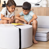 Lifestyle photo of two kids reading and sitting on the Foamnasium Blocksy+