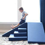 Boy sliding on Foamnasium Corner Climber in Navy