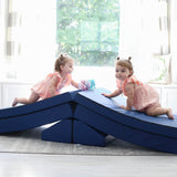 Two girls climbing over a Foamnasium Navy Blocksy