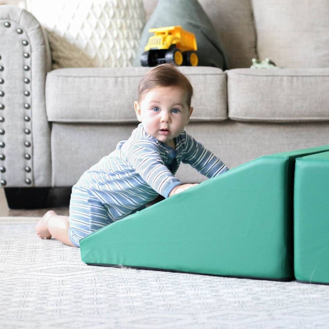 LIfestyle photo of boy playing with a enhanced emerald foamnasium wedge