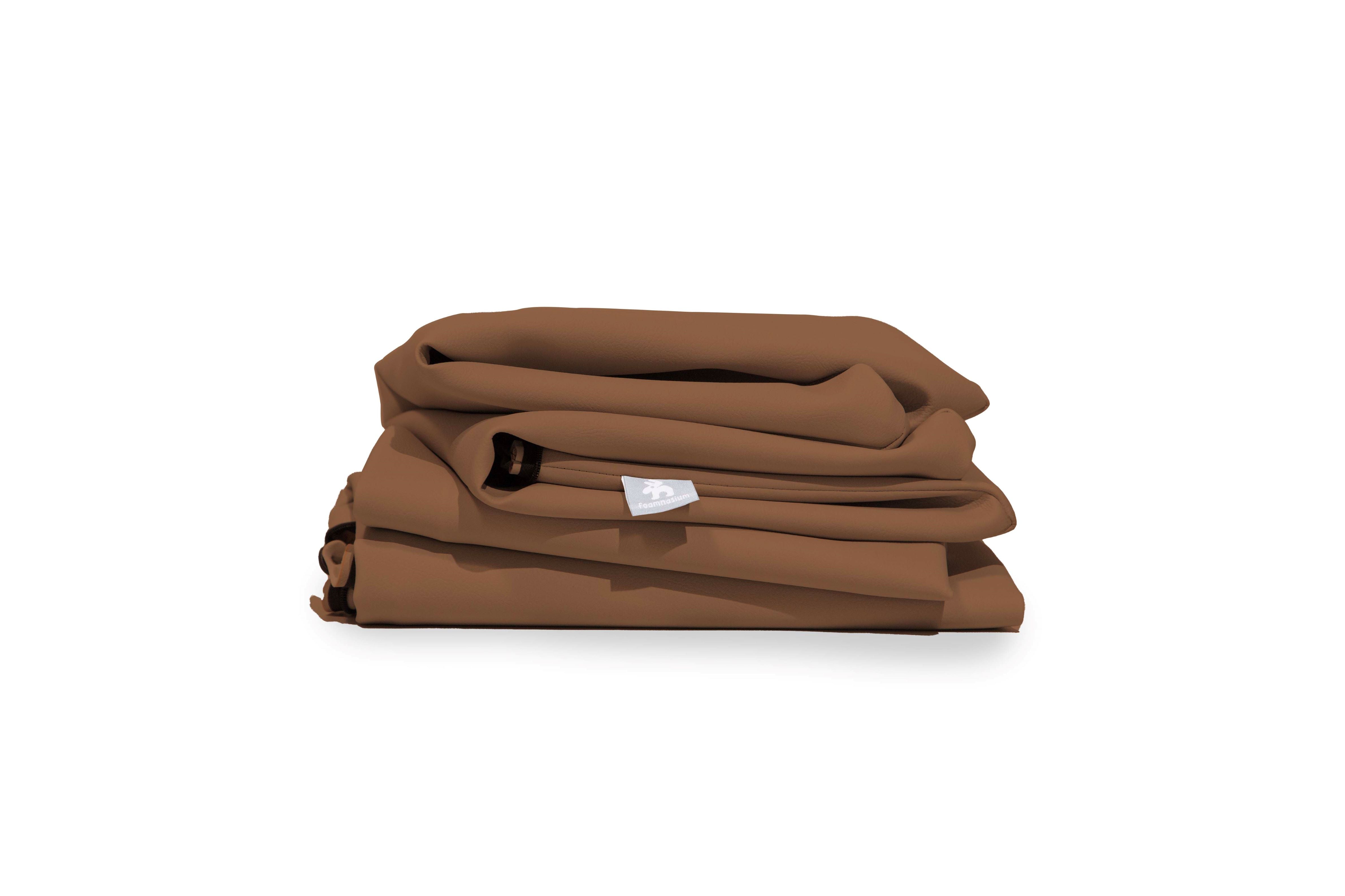 Stack of folded mint green fabric items with black end details, likely curtains or bedding