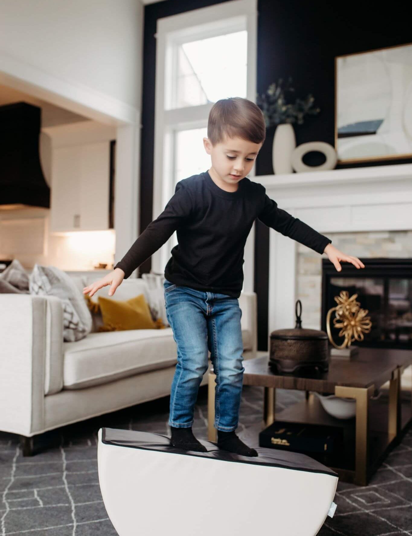 Lifestyle Photo of a boy balancing on an Enhanced Snow Foamnasium Mini Tumbler