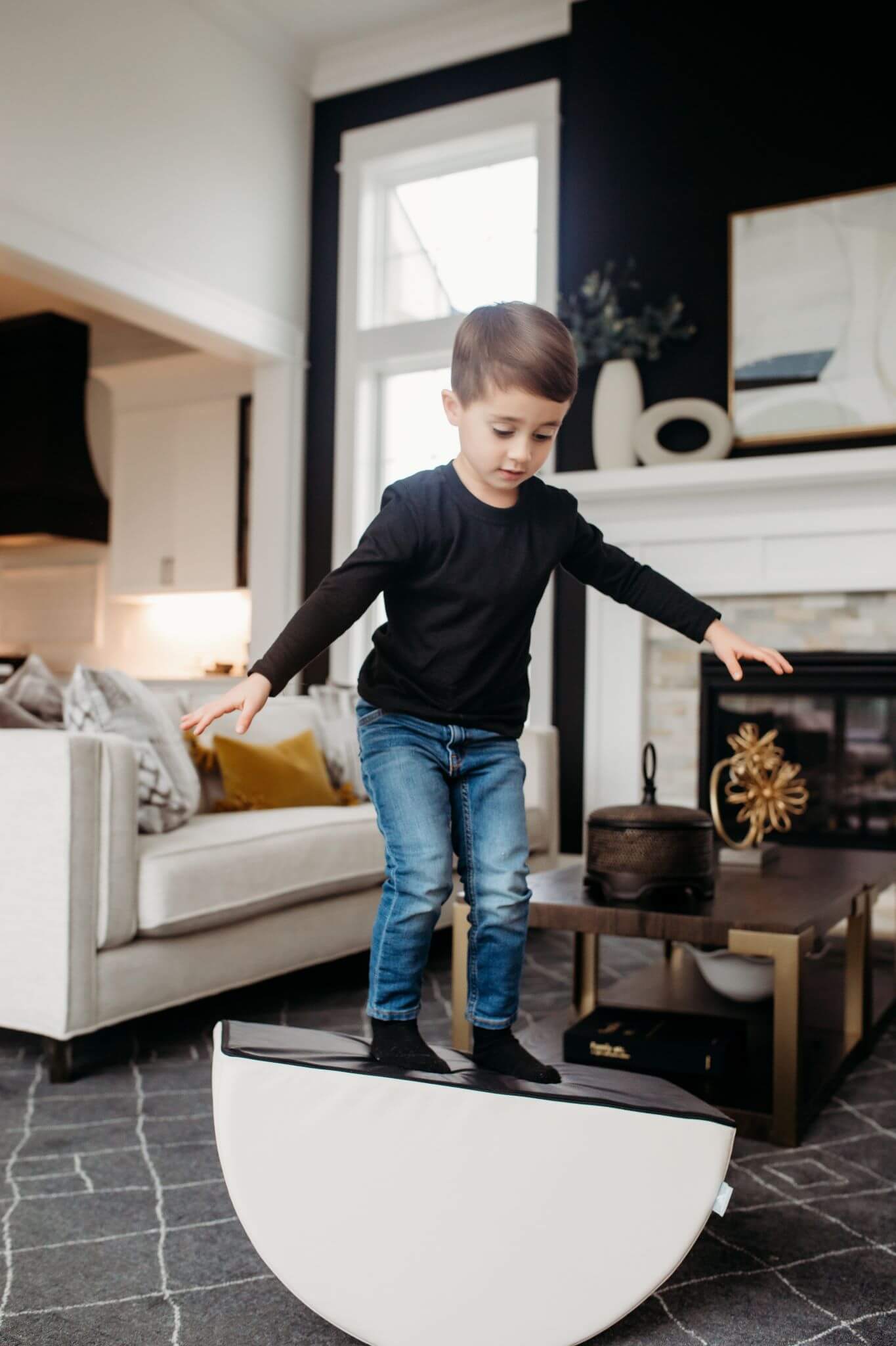 Lifestyle Photo of a boy balancing on an Enhanced Snow Foamnasium Mini Tumbler