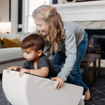 Lifestyle image of two kids playing on snow mini tumblers by Foamnasium