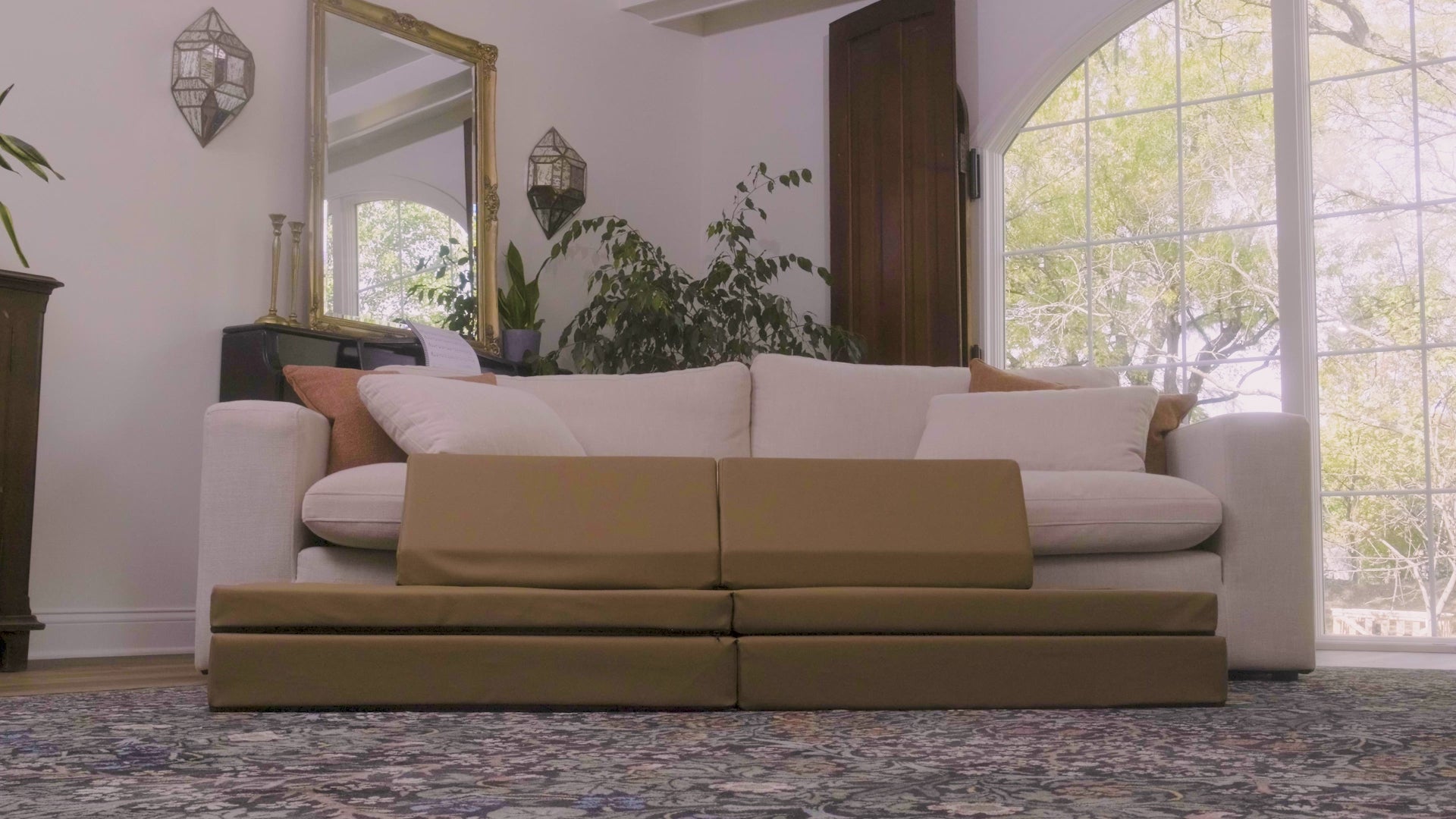 Brown modular sofa with two backrests, two-seat cushions in a symmetrical layout.